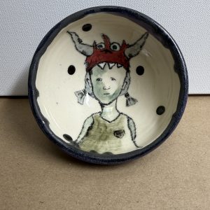 girl in monster hat bowl