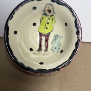 A girl and her bunny bowl